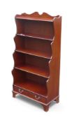 Reproduction mahogany waterfall bookcase with two drawers, H152cm, W76cm x D26cm. COURIER OR