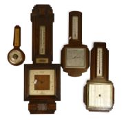 A Collection of oak cased wall barometers. (4)