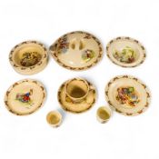 A collection of Royal Doulton Bunnykins nursery ware including heated oatmeal dish, plates, cups and