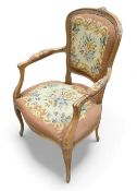 French Louis XV style needlepoint armchair with floral design & carved decoration. COURIER OR