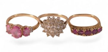 Three 9ct gold dress rings, each set with red and white stones, sizes L/Q, 7.6g. (3)