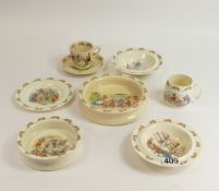 A collection of Royal Doulton Bunnykins nursery ware including oatmeal dishes, bowls plates, cup and