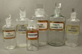 Six Antique Apothecary bottles with recessed labels reading IODOFORM, CLOB: PRUNELL:, ESS: AMYGDAL:,