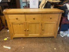 Modern solid oak 3 door, 3 drawer sideboard, H 87cm x W 150cm x D 44cm.