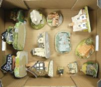 A collection of miniature English cottages and buildings by David Winter, Misty Wood Collectables