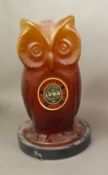 GUINNESS: An amber glass owl money box, produced by Guinness in 1980 to support the Licensed