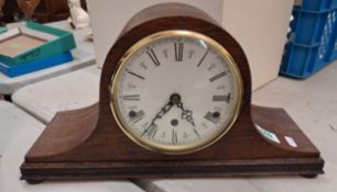 Oak cased mantle clock of Napoleon hat form, width 43cm.