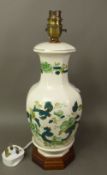 Mason's Green Chartreuse pattern table lamp, raised on a hardwood plinth, height to top of fitting
