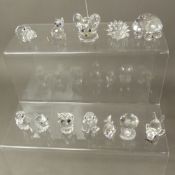 A collection of boxed Swarovski crystal animal figures, including Seal, Hen, Hedgehog, Tortoise,