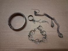 Parcel of sterling silver items, including a hinged bangle, charm bracelet, pendant, etc.,