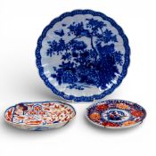 A collection of Japanese porcelain including a shaped charger decorated with birds and two Imari