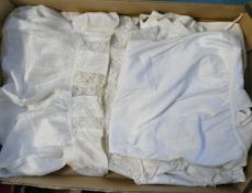 A selection of textiles to include:- Three terry fabric Victorian Baby long scalloped edged apron