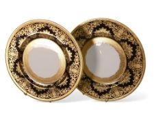 De Lamerie Fine Bone China, a pair of heavily gilt on black plates. Made in England (2)