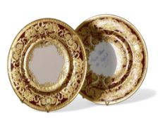 De Lamerie Fine Bone China, heavily gilt plates on burgundy. Made in England (2)