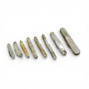 A collection of stainless steel and mother-of-pearl folding fruit knives, with intricate carvings or