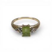9ct gold QVC ring set with central light green stones surrounded by white stones, size P, 2.5g.