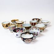 A collection of 19th century porcelain tea cups in various patterns from different manufacturers