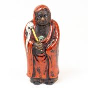 Japanese ceramic figure of Buddhist monk Daruma, after Bodhidharma, h.18cm.