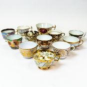 A collection of 19th century porcelain tea cups in various patterns from different manufacturers