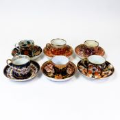 A collection of 19th century porcelain coffee cans and saucers in various patterns from different
