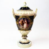 KPM Berlin porcelain two handled vase & cover, gilded hand painted panel of Rococo scene of couple