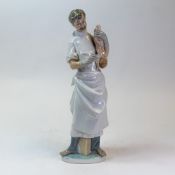 Lladró porcelain Figure of a Obstetrician model no:- 4763. Depicting a male doctor holding a new