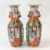 Pair of Chinese porcelain Canton Famille Rose vases, with alternating panels of figures in