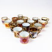 A collection of 19th century porcelain coffee cans in various patterns from different