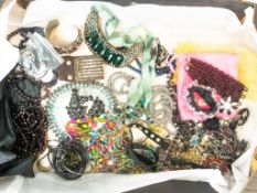 A large collection of costume jewellery, including beads, necklaces, earrings, rings, bracelets,