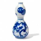 Chinese blue and white double Gourd vase decorated with Prunus, birds and trees, h.20cm.