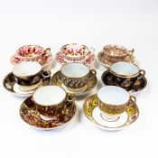 A collection of 19th century porcelain tea cups and saucers in various patterns from different