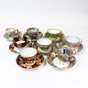 A collection of 19th century porcelain tea cups and saucers in various patterns from different
