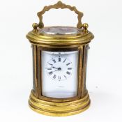 19th century miniature oval brass carriage clock, marked Vincent to dial, in original leather