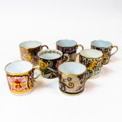 A collection of 19th century coffee cans in various patterns with gilt highlights. (7)