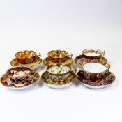 A collection of 19th century porcelain teacups and saucers in various patterns from different