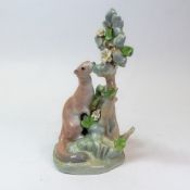 Lladró porcelain figure of a Ermine against a tree and flowers on a naturalistic base. H:-24cm