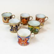 A collection of 19th century coffee cans in various patterns with gilt highlights. (6)