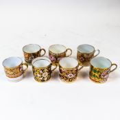 A collection of 19th century coffee cans in various patterns with gilt highlights. (7)