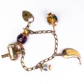 9ct Gold bracelet, set with five charms which contain semi precious stones, gross 24.2g.