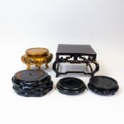 A collection of Chinese and Japanese hardwood vase display stands. (5)