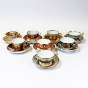 A collection of 19th century porcelain tea cups and saucers in various patterns from different