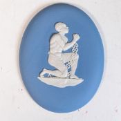 A Wedgwood anti-slavery medallion, oval shape composed of white on pale blue Jasper, the iconic