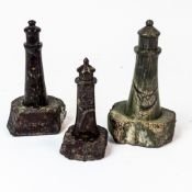 Cornish Serpentine stone lighthouse sculptures, two carved from Serpentine stone with red tones with