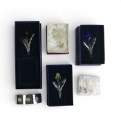 A collection of boxed Swarovski renewal gift crystal items including Blue Tulip 606546, Yellow Tulip