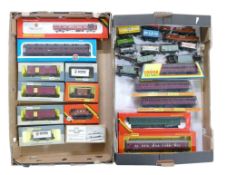 A collection of OO/HO gauge passenger carriages and freight carriages to include Hornby R.413
