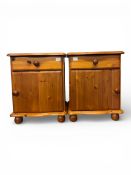 Pair of pine bedside cabinets with L & R orientation. Single cupboard and drawer, standing on bun