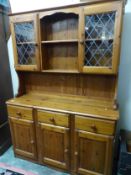 Pine dresser, 3 doors and 3 drawers to the base section, plate rack and 2 glazed leaded doors to the
