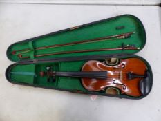 A cased early 20th century violin with two bows (attention needed) the violin has recently been re-