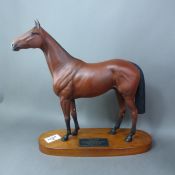 Beswick Connoisseur model of Red Rum on wooden plinth.