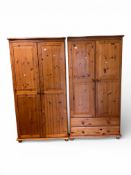 Pair of Duchess pine double wardrobes on bun feet. One full length with internal shelf and hanging